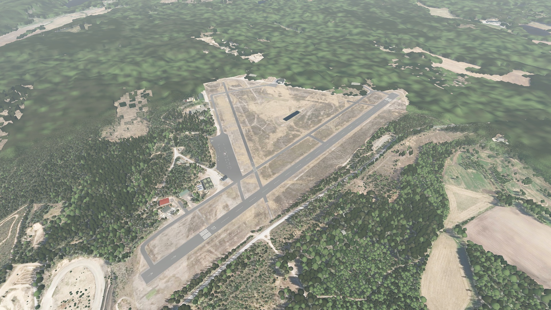 Closer aerial view of both runways and the surrounding forest at Vesivehmaa in MR Flight